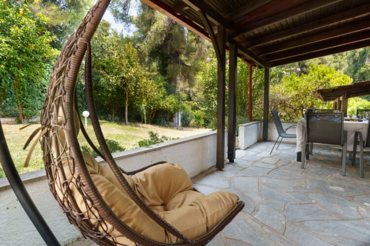 Outdoor dining area with swing