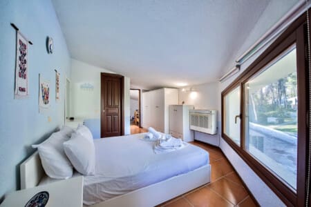 Bedroom with queen size bed and bathroom